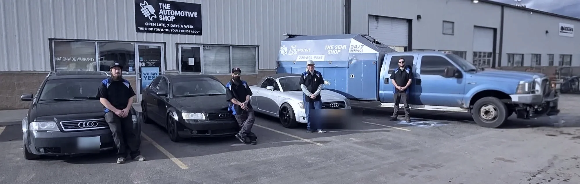 The Automotive Shop team standing with customer vehicles in front of the Jerome, Idaho shop